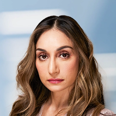 A headshot photo of Dr. Balvinder Bharj, the board certified optometrist at Enhanced Eyecare NJ